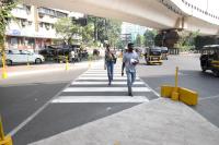 2 men on a street crossing/zebra crossing