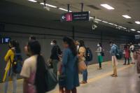 Women await the metro near the women's coach at a platform in Bengaluru