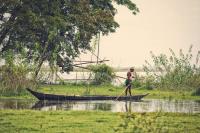 Boatman in water