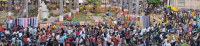 Crowd gathers in an urban space