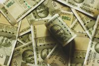 Many new five hundred rupee currency notes spread around.