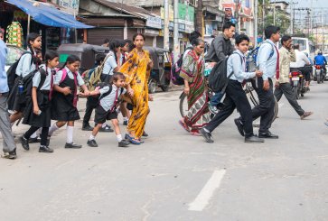 School children cross road