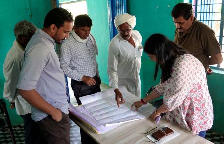 Discussion with Gulalya Kanoje (center) and other members of the gram panchayat in Matli on GIS-based planning for natural resource management.