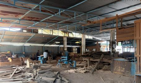 Furniture production unit in Kalapatha cluster, with workers processing teakwood