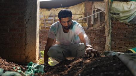 Ashish Dudhi checking on the vermicompost bed