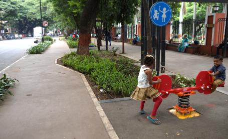 Renovated street in Pune with play equipment and children playing