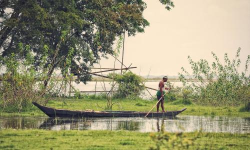 Boatman in water