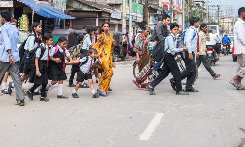 School children cross road