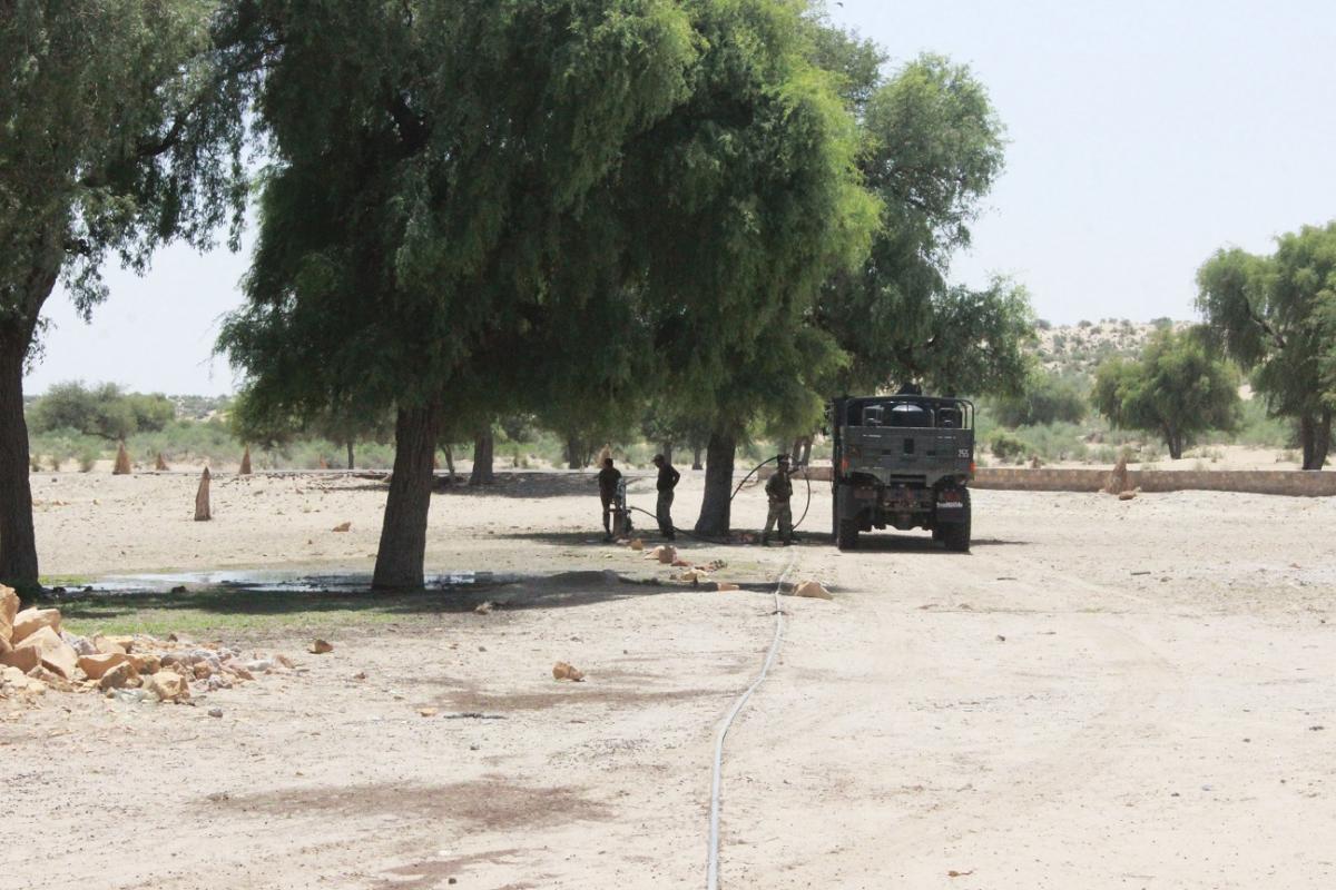 Border Security Forces collecting water for their personal use and for the livestock/wild animals from the Kisangarh borewell.