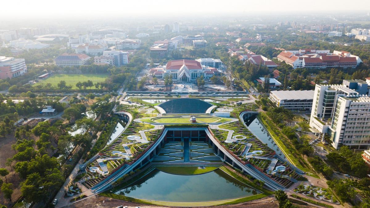 Thammasat University rooftop farm with cascading roof designed to slow down rainwater run-off, and form unique clusters of micro-watersheds along the terrace to help absorb, filter and purify rainwater while growing food for the campus